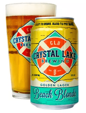 Photo of a full pint glass and a can of the Beach Blonde Golden Lager by the Crystal Lake Brewing Company